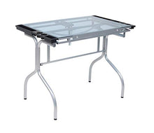 Load image into Gallery viewer, Studio Designs Folding Modern Glass Top Adjustable Drafting Table Craft Table Drawing Desk Hobby Table Writing Desk Studio Desk, 35.25" W x 23.75" D, Silver / Blue Glass