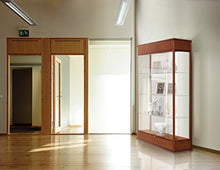 Load image into Gallery viewer, Waddell Varsity Sliding Doors Lighted Display Case, 48W by 77H by 18" D, Mirror Back with Autumn Oak Finish